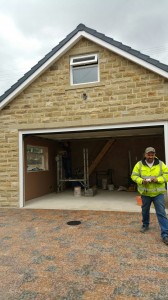 Stone garage with door open